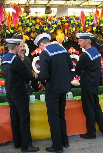 Three cute navy sailors shopping in uniform